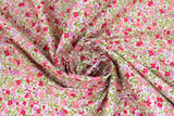 Swirled swatch Pink fabric (white fabric with busy collaged tiny floral heads and leaves allover in pink shades, purple and green)