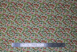 Flat swatch Decorative Scroll fabric (white fabric with leafy scroll swirly shapes allover in red and green shades with gold deatils)
