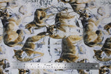 Flat swatch woodland themed fabric in wolves in snow (white fabric with brown/grey wolves assorted and grey nature background)