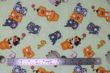 Flat swatch flower pot kitty fabric (pale lime green fabric with white polka dots and tossed orange, grey, black etc. cartoon kitties some in flower pots with a flower on head, fish bones, etc.)