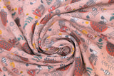 Swirled swatch floral printed fabric in print sea (light pink fabric with doodled/sketched sea creatures, bubbles, sea plants in orange and dark pink)