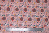Flat swatch floral printed fabric in print sea (light pink fabric with doodled/sketched sea creatures, bubbles, sea plants in orange and dark pink)
