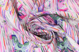 Swirled swatch migration themed printed fabric in icebergs (colourful iceberg and water reflections printed on white)