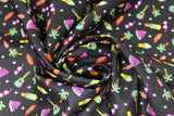Swirled swatch Delish Delights fabric (black fabric with tiny tossed colourful emblems allover: birds, palm trees, sunglasses, guitars, etc.)