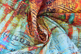 Swirled swatch rusted patina fabric (yellow/orange marbled look fabric with black grid like shape outlines and blue/green marbled fabric with faint black music staff lines and notes)