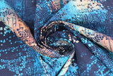 Swirled swatch fractured mosaic fabric (light to dark blue marbled look fabric with black mosaic look pieces and outlines scattered allover and white/rust coloured sections)