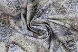 Swirled swatch stained damask fabric (neutral and grey weathered look fabric with grey and white damask pattern allover and faint newspaper style writing)