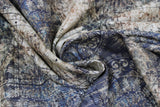 Swirled swatch Muted Medallions fabric (off white and pale medium blue fabric with distressed look, subtle black text and lines, and circular faint cream decorative medallions)