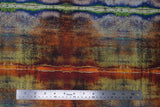 Flat swatch Dyed Stripe fabric (multi-tonal marbled look fabric with subtle dyed stripe look, black text and lines, and subtle black floral/leaf design: green, blue, orange, rust colourway)