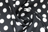Swirled swatch linework themed fabric in pom poms ink (black fabric with medium sized white polka dots)