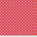 Swatch of pom pom (dots) printed fabric in poppy (pink/red)