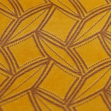 Square swatch of velvet upholstery fabric with abstract squares/diamonds/dots outlines design (dark yellow fabric with light brown pattern)