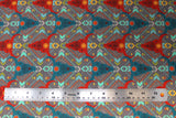 Flat swatch of multi-coloured animal skull fabric