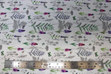Flat swatch of small butterfly/floral print on white