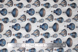 Flat swatch nacelle fabric (off white fabric with tossed blue and beige hot air balloons in vintage style, faint circular designs in background)