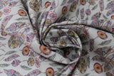 Swirled swatch of Mohican printed fabric in feathers