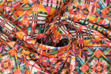 Swirled swatch abstract fabric (busy abstract geometric design quilt square look fabric on white in heavy orange, pink, black, purple, green colourway)
