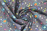 Swirled swatch Carcas fabric (dark blue/black fabric with busy southwest look pattern with geometric style shapes allover in blue, orange, pink, purple colourway)