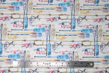 Flat swatch rames fabric (white fabric with various boating related emblems allover white, yellow, blue ores, yellow rope/knots, anchors, buoys, etc.)