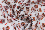 Swirled swatch bows fabric (white fabric with tossed dogs and cats in brown, white and grey with red and bronze bows and collars tossed)