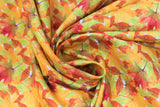 Swirled swatch fall leaves fabric (pale/white look fabric with busy small autumn leaves collaged allover in yellow, orange, red, green colourway)