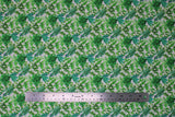 Flat swatch greens fabric (white fabric with small tossed/collaged greenery, leaves, stems, herbs allover in various styles and shades of green)