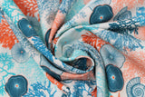 Swirled swatch coral fabric (off white fabric with tossed coral plant drawings/silhouettes in teal, light and dark blue, orange, with tossed blue and orange fish and sea plants/shells)