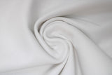 Swirled swatch of ribbing material in optical white