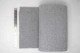 Tube of ribbing material in light grey melange