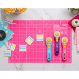 Rotary Cutters in assorted colours on pink rotary mat