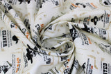 Swirled swatch Wanted Dead or Alive fabric (cream fabric with vintage style "Wanted" posters with cowboy skeletons, guns, rewards, etc.)