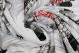 Swirled swatch the lodge fabric (white fabric with faint grey large pinecones tossed in background, grey/black trees and mountains tossed and drawn brown and red lodges/cabins)