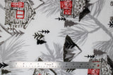 Flat swatch the lodge fabric (white fabric with faint grey large pinecones tossed in background, grey/black trees and mountains tossed and drawn brown and red lodges/cabins)