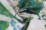 Swirled swatch Peacock Arbour fabric (natural coloured fabric with floral background and large tossed illustrative style peacocks in full colour)