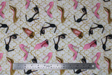 Flat swatch glam themed fabric in glam heels (white fabric with faint gold geometric pattern and tossed high heels allover in black, pink, and gold)