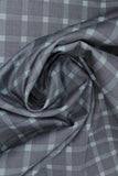 Swirled swatch American themed printed fabric in Blue & Navy Plaid