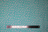 Flat swatch Aqua Dasies fabric (small aqua blue floral tossed allover with medium sized white floral heads with purple centers)