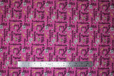 Flat swatch Australia fabric (magenta fabric with busy tossed black text allover reading Australian creature names "Koala" "Kiwi" etc. and small tossed Australian animal friends)