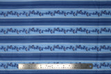 Flat swatch winter printed fabric in Pinecone Stripes on Light Blue