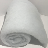 Small thick roll of white craft/quilt batting out of packaging on a white background