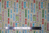 Flat swatch Beach Signs fabric (white/beige speckled sand look fabric with busy white board look signs allover in various sizes and shapes with beach related text in various colours allover "Beach" "Sea Side" "Life Guard" etc.)