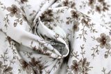 Swirled swatch Blueberry Buckle (and floral) themed fabric in Brown Flowers on White