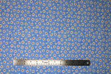 Flat swatch Blue Daisies fabric (tiny blue floral heads tossed allover with medium sized white daisy heads with burgundy centers)