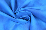 Swirled swatch Blue Shadow fabric (medium blue fabric with subtle marbled look)