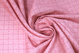Swirled swatch Boots and Spurs printed fabric in Pink Diamonds & Flowers on Light Pink