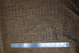 Flat swatch brass coloured gator style textured vinyl fabric