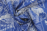 Swirled swatch California themed fabric in White Flowers & Shack on Blue