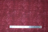 Flat swatch calico fabric in burgundy dots on burgundy