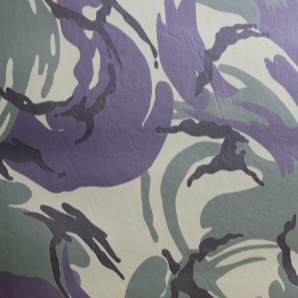 Swatch of camouflage printed smooth vinyl fabric