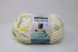 Ball of Bernat Baby Blanket in shade Chicks 'n Bunnies (yellow, white, taupe)